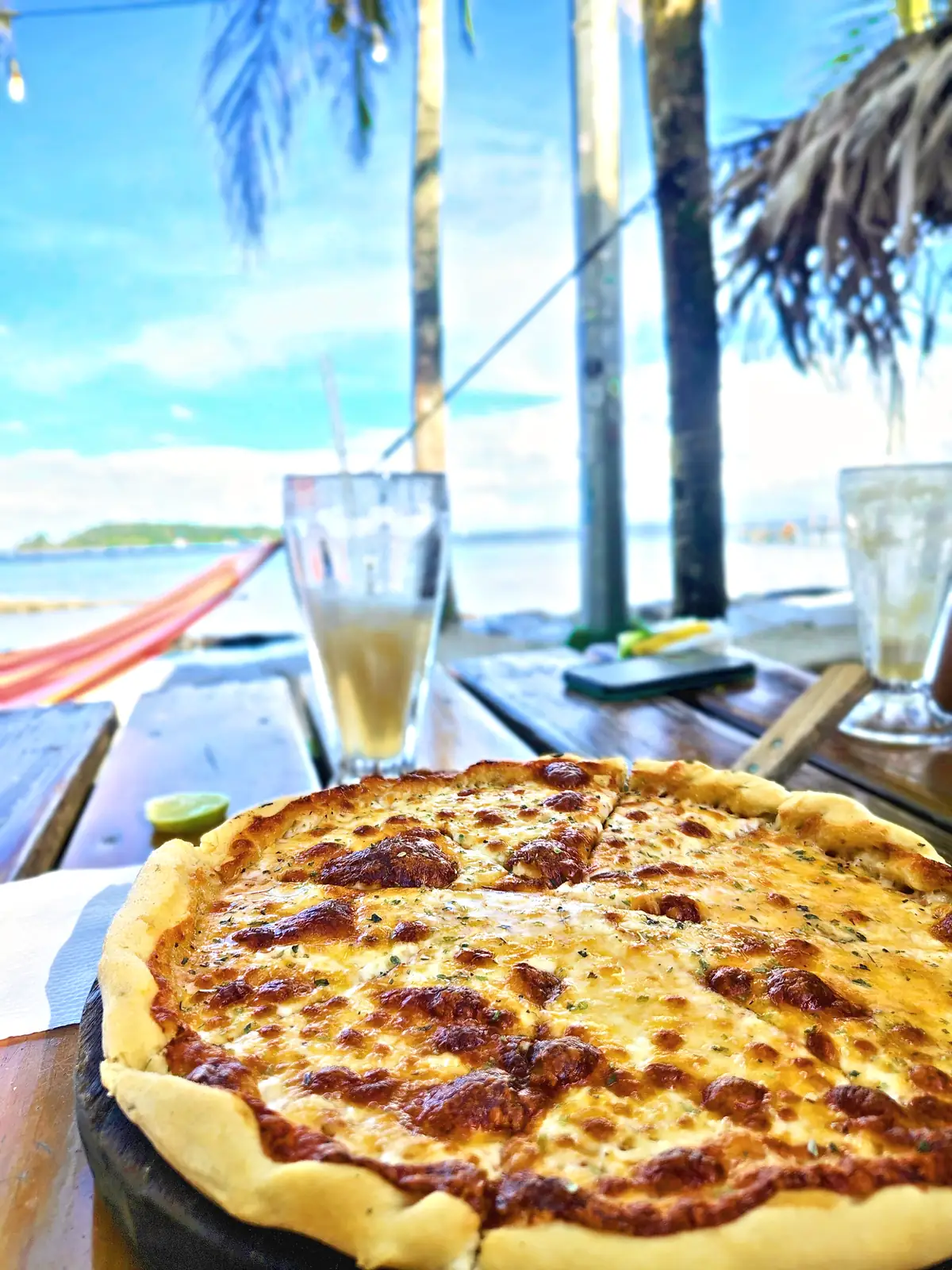 A pizza on a terrace above the sea at Carenero, Bocas del Toro