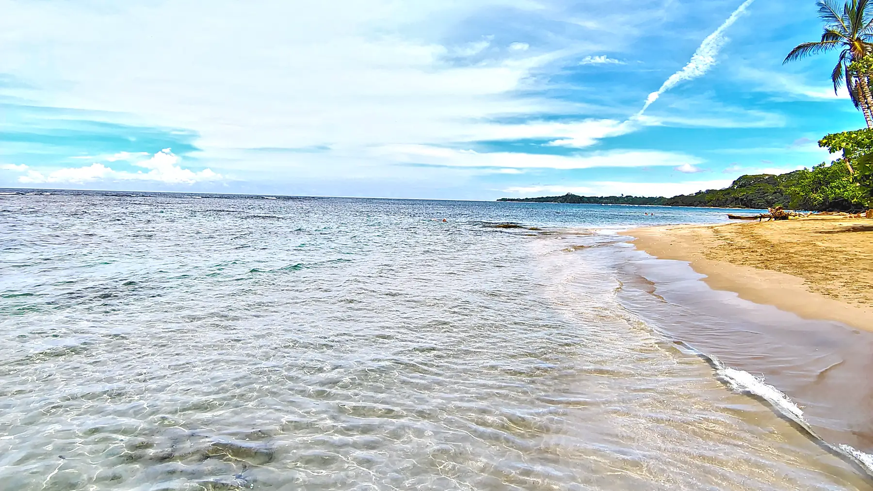 Clear shallow water and a pale sand beach at Playa Chiquita
