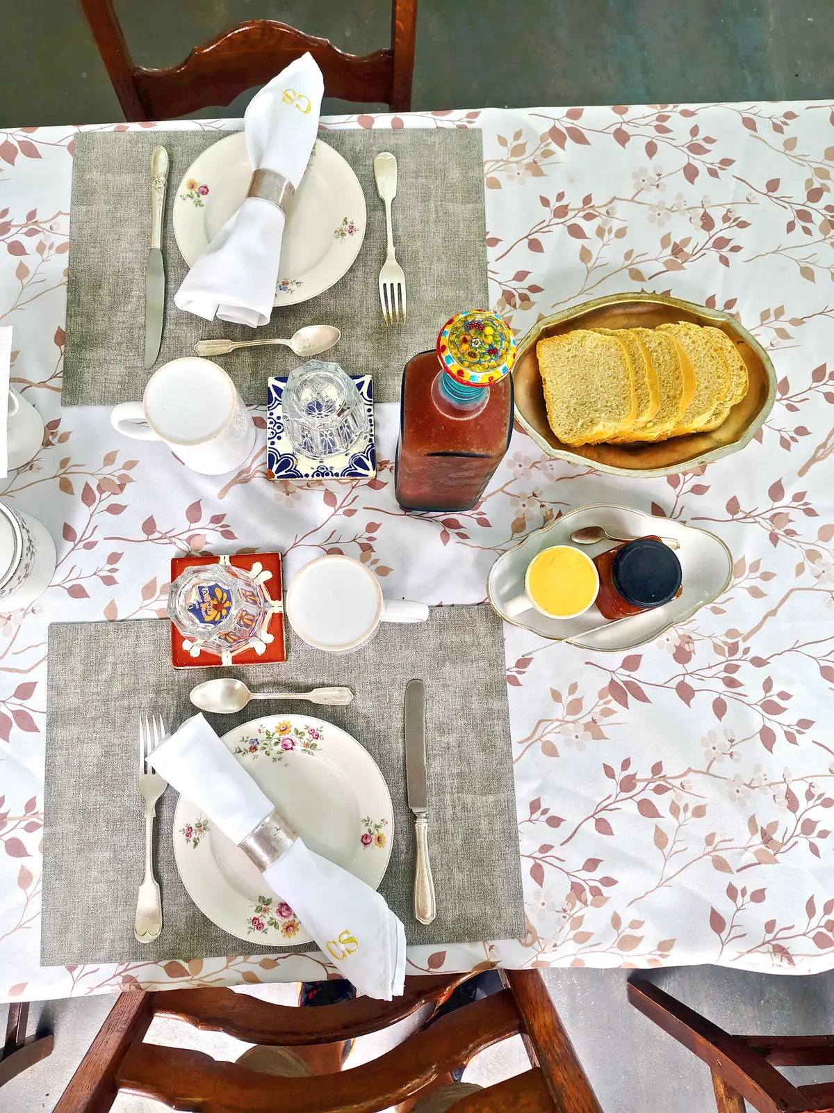 A breakfast table set with toast, jam and coffee