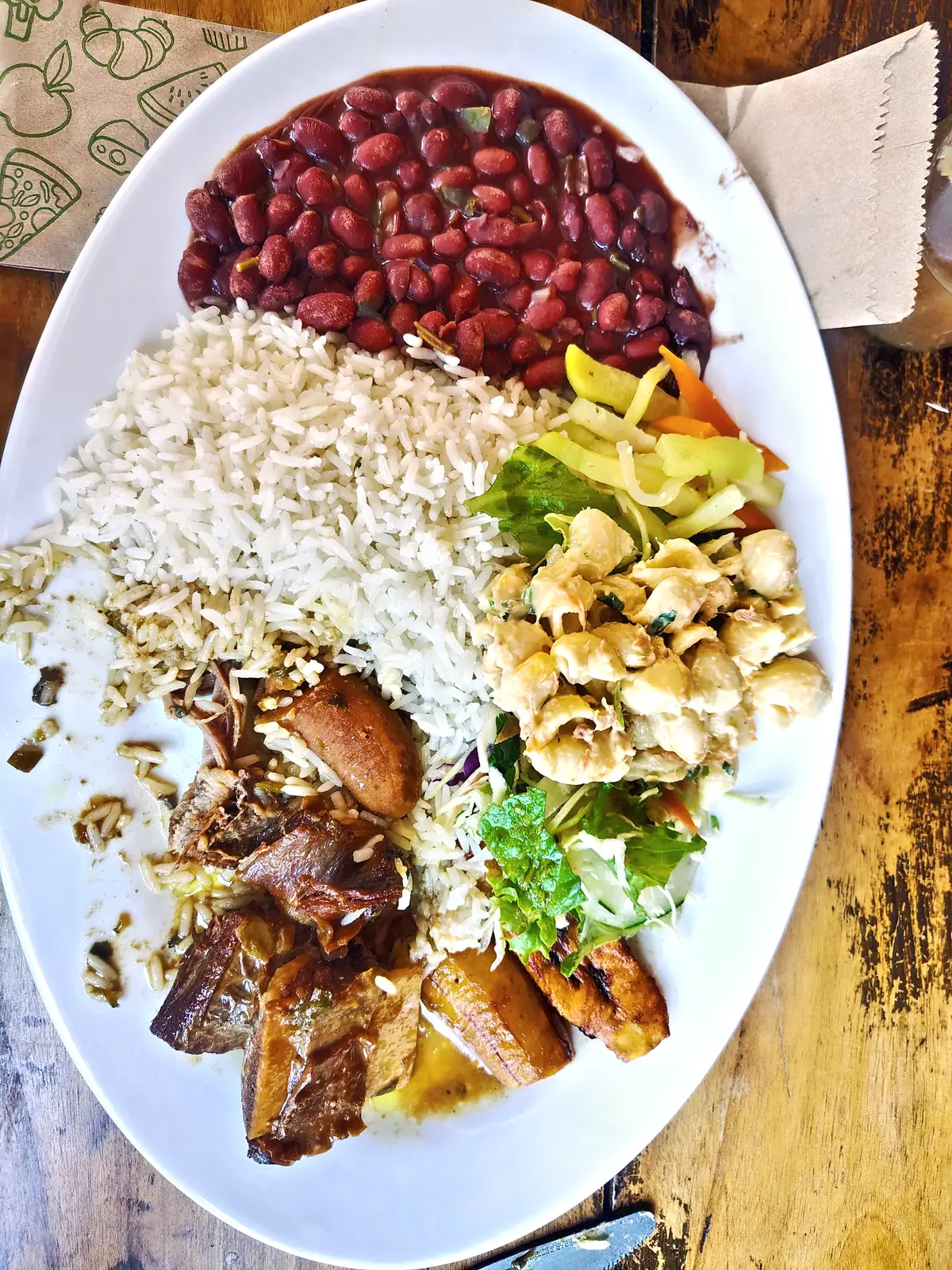 A casado plate of rice, beans, salad, chicken and plantain in Puerto Viejo