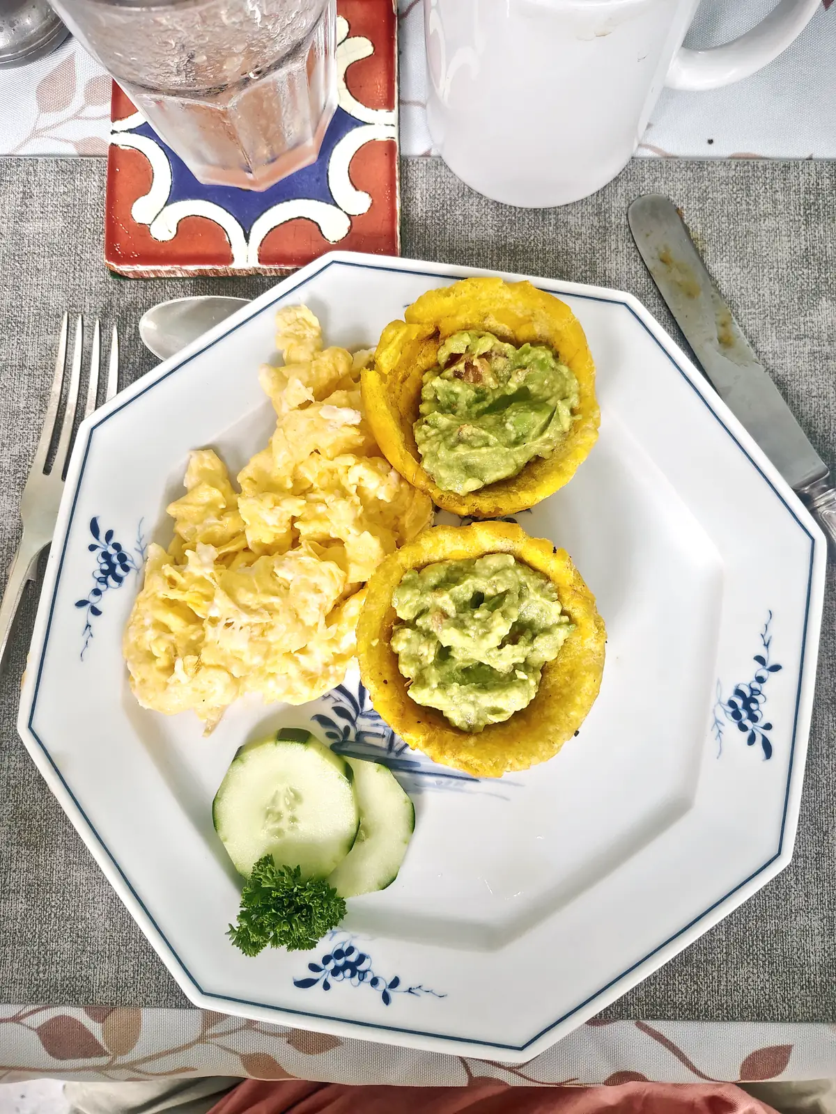 Scrambled eggs and guacamole in plantain cups, with cucumber