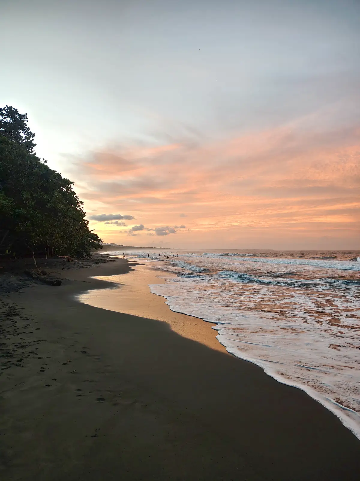 Pink evening sky over the black sand at Playa Negra